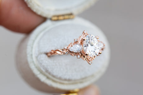 Briar rose three stone with oval moissanite and pear side stones