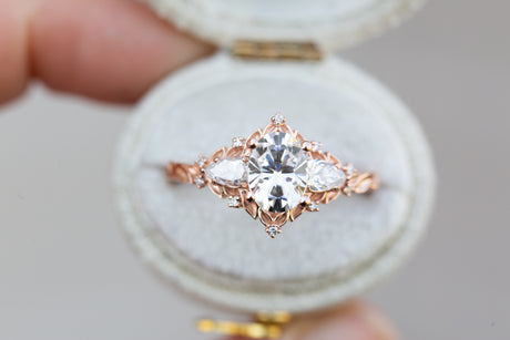 Briar rose three stone with oval moissanite and pear side stones