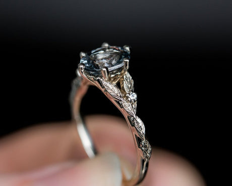Oval grey spinel leaf ring