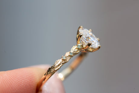 Rowan setting with oval moissanite and mint diamonds