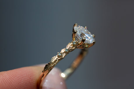 Rowan setting with oval moissanite and mint diamonds