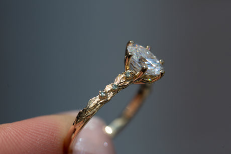 Rowan setting with oval moissanite and mint diamonds