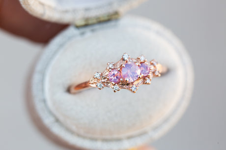 Woodland setting with round opalescent sapphires