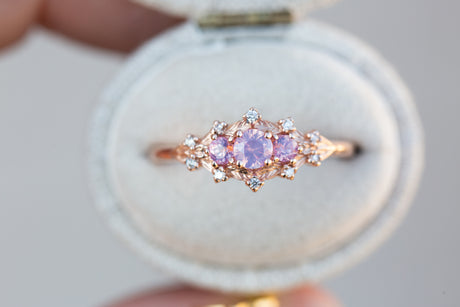 Woodland setting with round opalescent sapphires