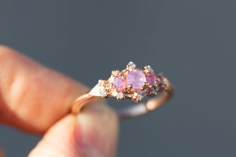 Woodland setting with round opalescent sapphires