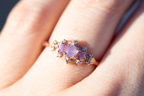 Woodland setting with round opalescent sapphires