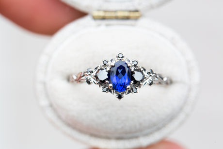Briar rose three stone with blue sapphire and black diamonds