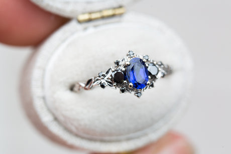 Briar rose three stone with blue sapphire and black diamonds