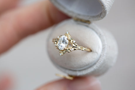 The Aurora setting with oval moissanite
