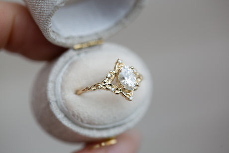 The Aurora setting with oval moissanite