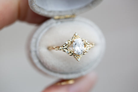 The Aurora setting with oval moissanite