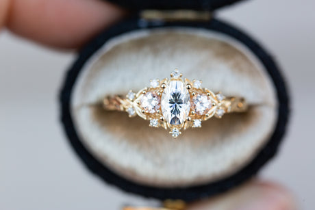 Briar rose three stone with oval moissanite and round peach sapphire side stones (fairy queen)