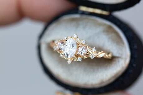 Briar rose three stone with oval moissanite and round peach sapphire side stones (fairy queen)