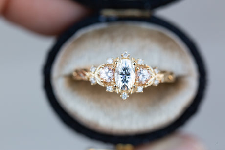 Briar rose three stone with oval moissanite and round peach sapphire side stones (fairy queen)