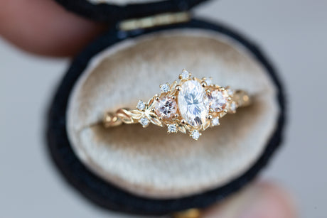 Briar rose three stone with oval moissanite and round peach sapphire side stones (fairy queen)