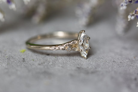 Marquise moissanite leaf cathedral engagement ring