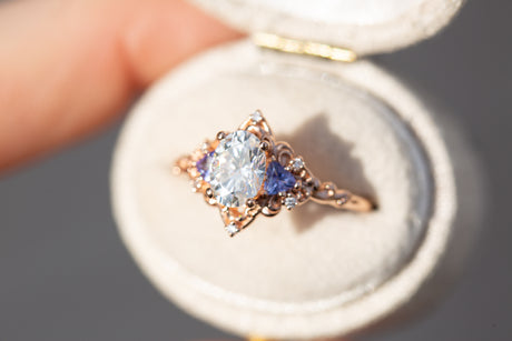 Aurora three stone with oval moissanite and tanzanite