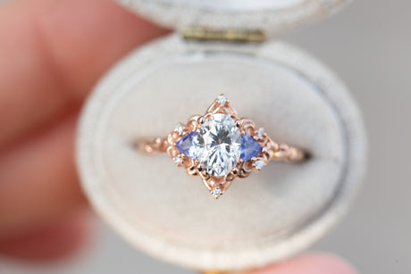 Aurora three stone with oval moissanite and tanzanite
