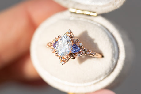 Aurora three stone with oval moissanite and tanzanite