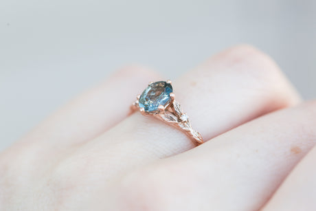 Oval grey spinel leaf ring