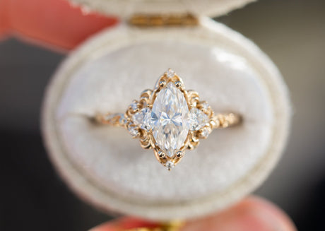 Aurora three stone with marquise moissanite