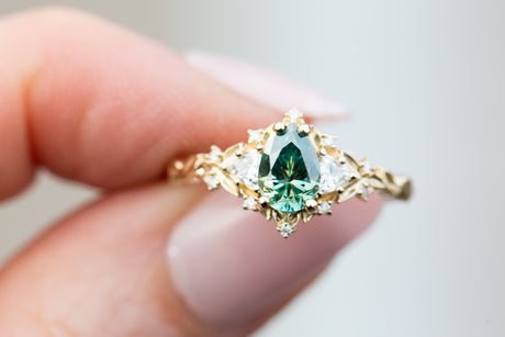 Briar rose three stone with pear teal moissanite