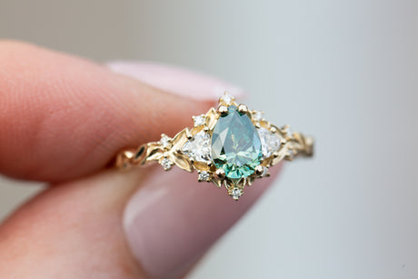 Briar rose three stone with pear teal moissanite