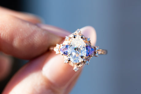 Woodland three stone with pear moissanite and tanzanite
