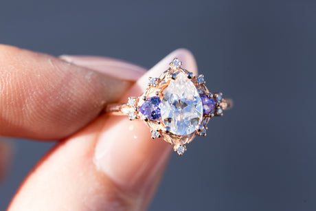 Woodland three stone with pear moissanite and tanzanite