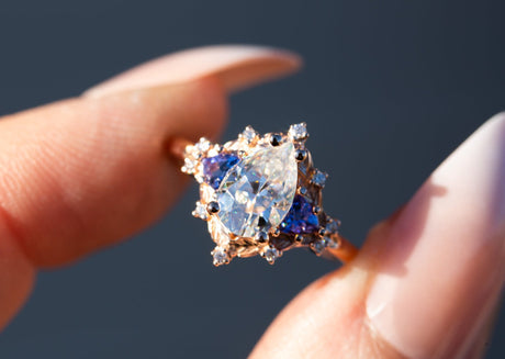 Woodland three stone with pear moissanite and tanzanite