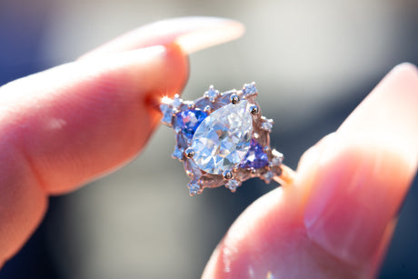 Woodland three stone with pear moissanite and tanzanite