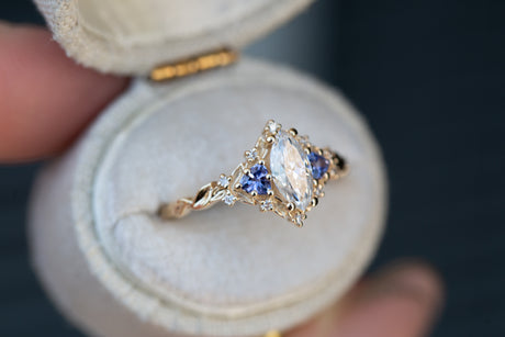 Briar rose three stone with marquise moissanite and tanzanite