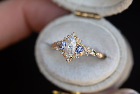 Briar rose three stone with marquise moissanite and tanzanite