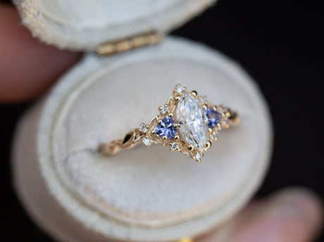 Briar rose three stone with marquise moissanite and tanzanite