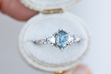 Briar rose three stone with oval teal starbrite sapphire