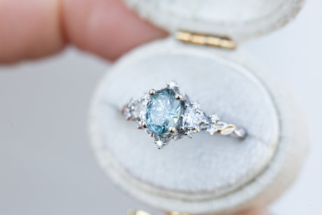 Briar rose three stone with oval teal starbrite sapphire