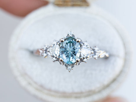 Briar rose three stone with oval teal starbrite sapphire