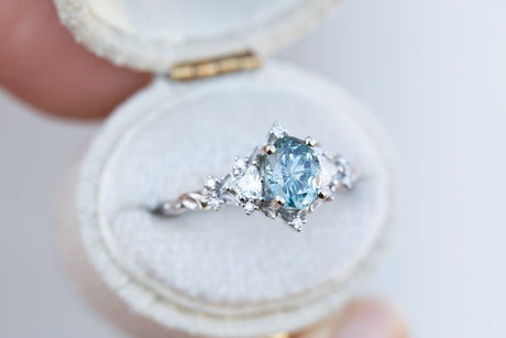 Briar rose three stone with oval teal starbrite sapphire