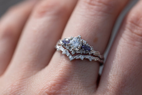 Briar rose three stone with round center and tanzanite sides