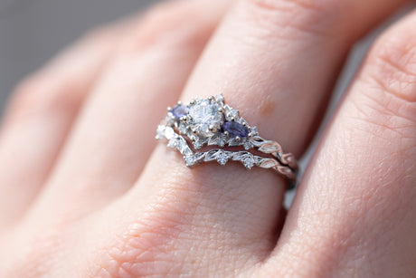 Briar rose three stone with round center and tanzanite sides