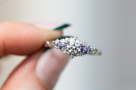 Briar rose three stone with round center and tanzanite sides