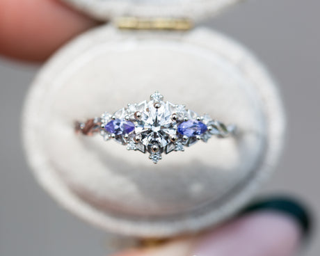 Briar rose three stone with round center and tanzanite sides