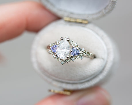 Briar rose three stone with pear moissanite and tanzanite