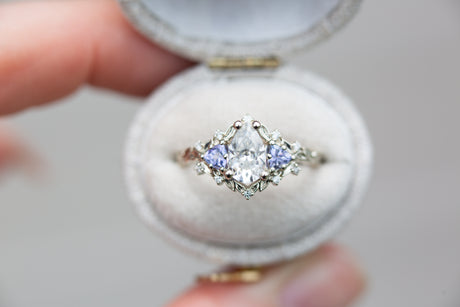 Briar rose three stone with pear moissanite and tanzanite
