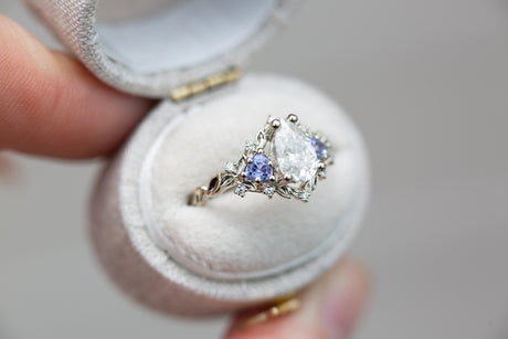Briar rose three stone with pear moissanite and tanzanite