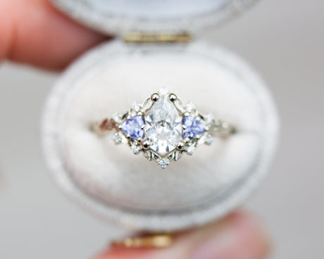 Briar rose three stone with pear moissanite and tanzanite