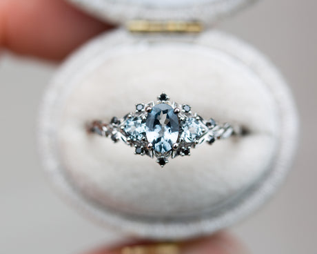 Briar rose three stone with grey spinel and black diamonds