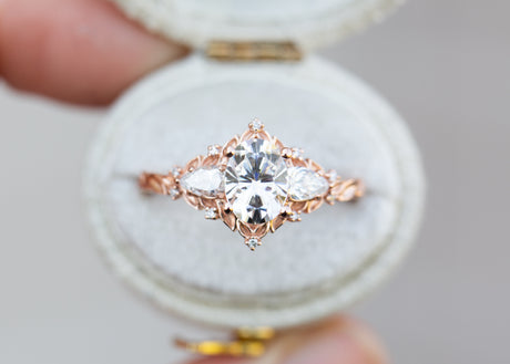 Briar rose three stone with oval moissanite and pear side stones
