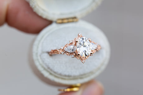 Briar rose three stone with oval moissanite and pear side stones