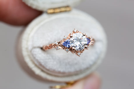 Briar rose three stone with round moissanite and tanzanite
